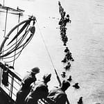 DUNKIRK 26 - 29 MAY 1940 (HU 41240) British soldiers wade out to a waiting destroyer off Dunkirk during Operation Dynamo. Copyright: © IWM. Original Source: http://www.iwm.org.uk/collections/item/object/205022146