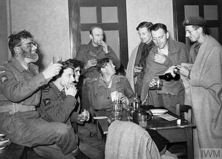 OPERATION 'MARKET GARDEN' (THE BATTLE FOR ARNHEM): 17 - 25 SEPTEMBER 1944 (HU 5417) Arnhem 17 - 25 September 1944: A group of survivors from the Arnhem Operation arriving at Nijmegen after the evacuation and having their first drink. One of them, Captain Jan Linzel (second from left) is a member of the Dutch Royal Navy attached to No 10 Commando. Copyright: © IWM. Original Source: http://www.iwm.org.uk/collections/item/object/205021987