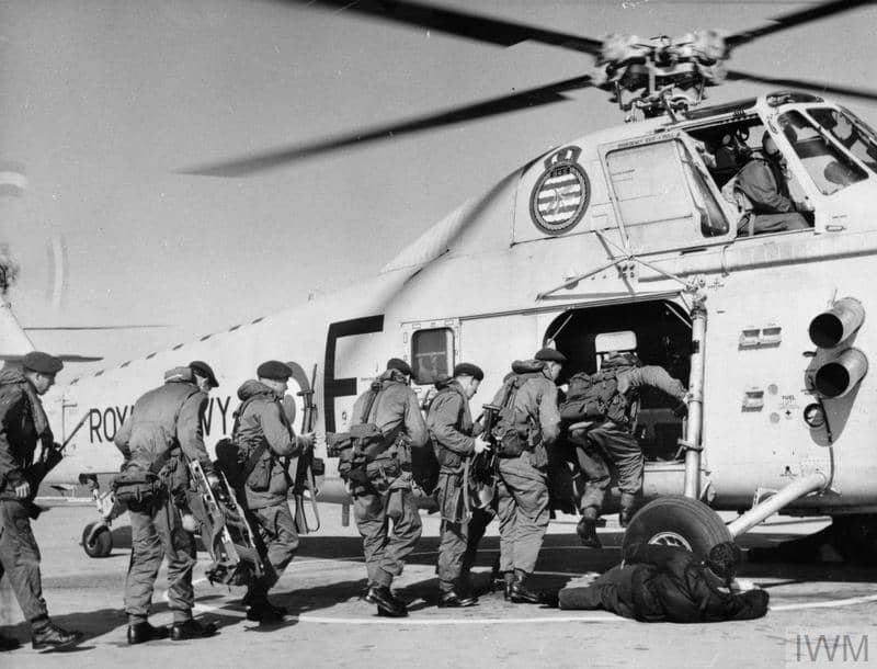 Flight deck scene as Royal Marines of 41 Commando embark in a Wessex helicopter.